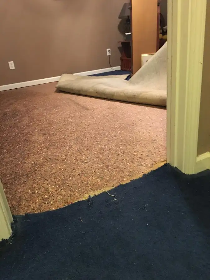 Carpet pad removal revealing water damage during Drying & Dehumidification in Chowchilla